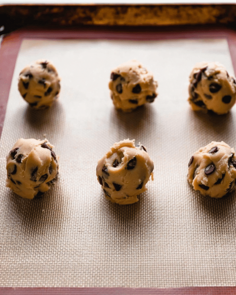 Chewy Chocolate Chip Cookies 4 Tall chocolate chip cookie dough balls on baking sheet before baking