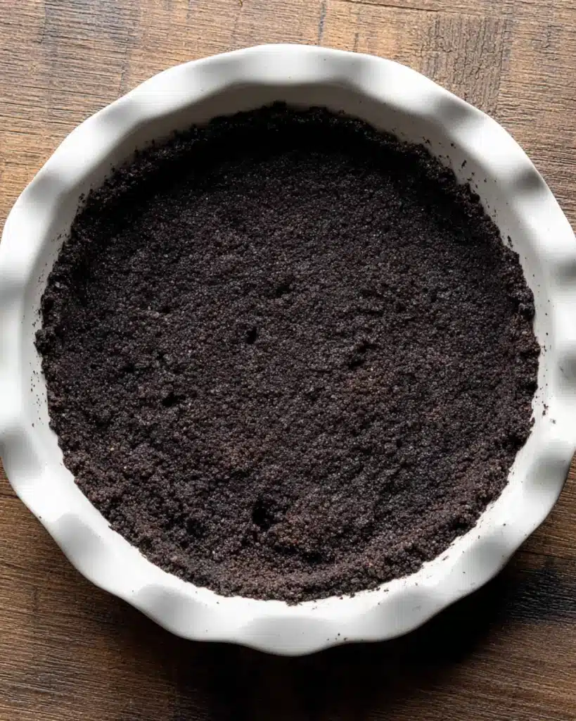 Chocolate Peanut Butter Pie (Thanksgiving Favorite) 2 Oreo cookie crust in a white pie dish for chocolate peanut butter pie