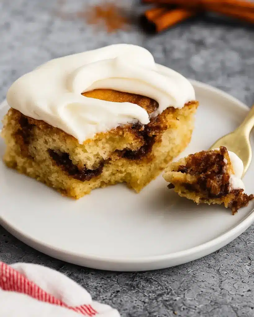 Cinnamon Roll Cake with Cream Cheese Frosting | Perfect Thanksgiving Dessert 6 Forkful of Cinnamon Roll Cake with Cream Cheese Frosting on white plate
