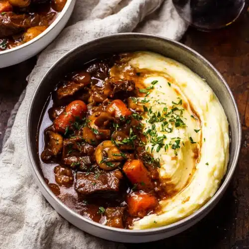 Classic Beef Bourguignon (Christmas Recipe) 8 Bowl of beef bourguignon with mashed potatoes and chives