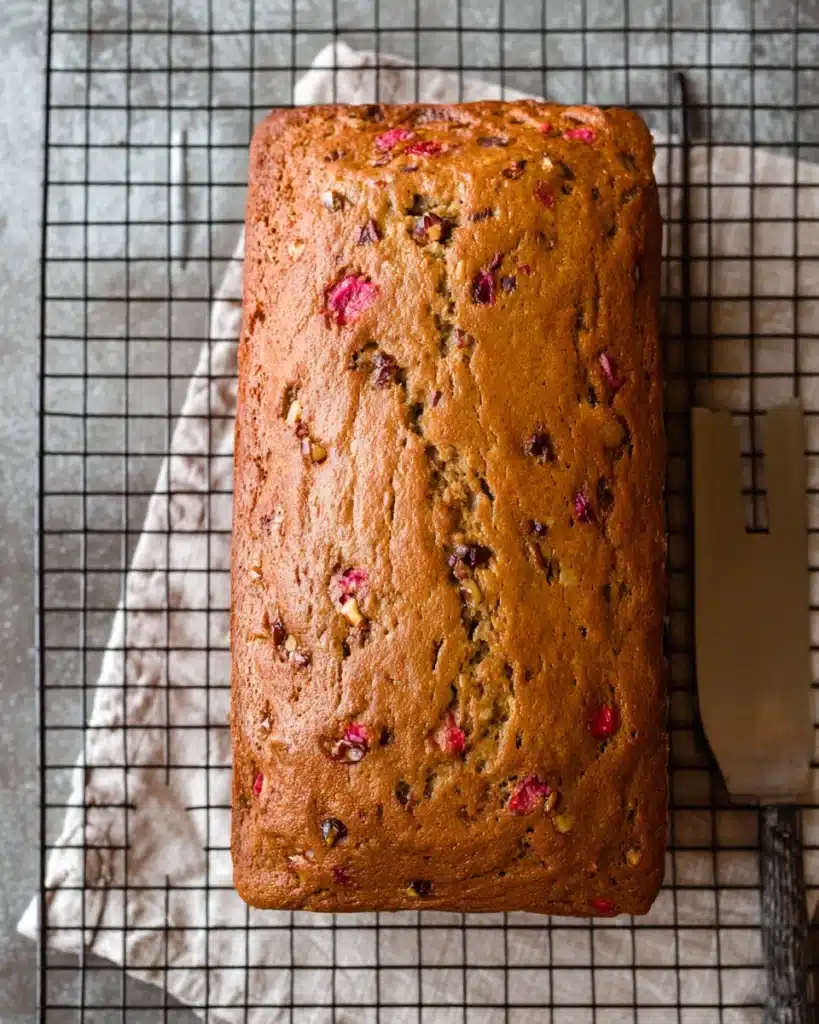 Cranberry Nut Bread – A Festive Holiday Favorite 4 Cranberry nut bread loaf cooling on a wire rack