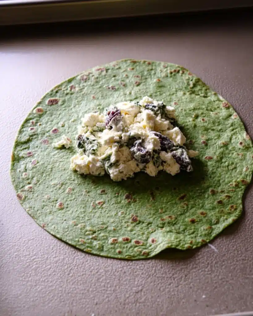 Cranberry and Feta Pinwheels 3 Spinach tortilla with cranberry and feta filling ready to spread