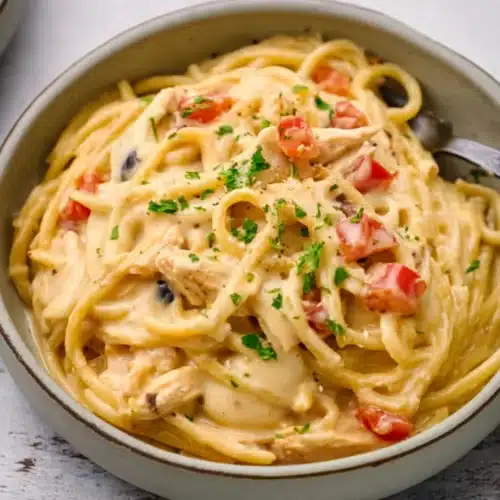 CrockPot Cheesy Chicken Spaghetti Recipe served in a bowl with creamy cheese sauce
