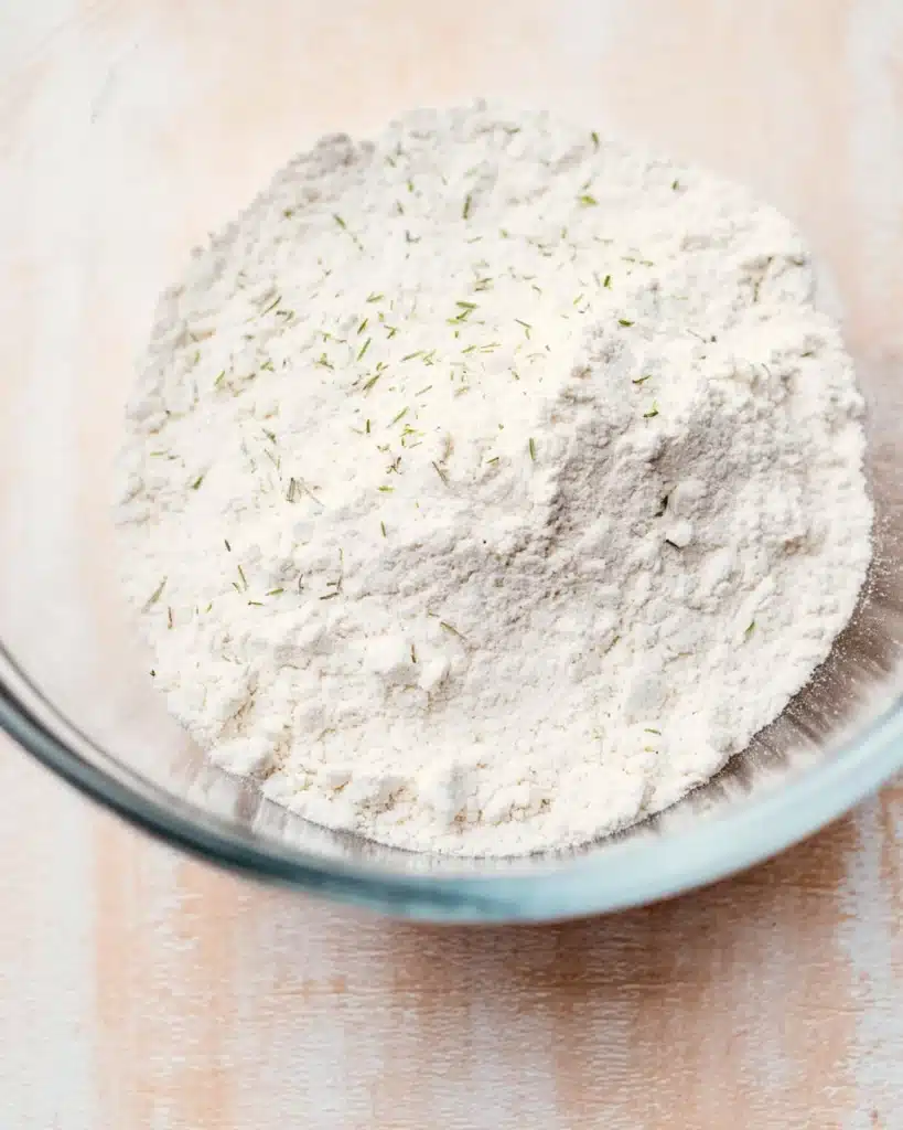 Easy Garlic Bread Rolls (Perfect for Thanksgiving) 2 Flour mixture in glass bowl for Easy Garlic Bread Rolls