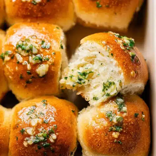 Easy Garlic Bread Rolls (Perfect for Thanksgiving) 9 Golden-brown Easy Garlic Bread Rolls topped with parsley and garlic
