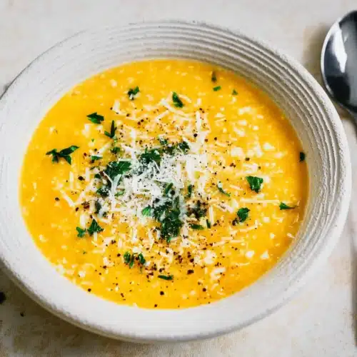 Italian Penicillin Soup Recipe 10 Creamy Italian penicillin soup with pastina, parmesan, and parsley in a white bowl