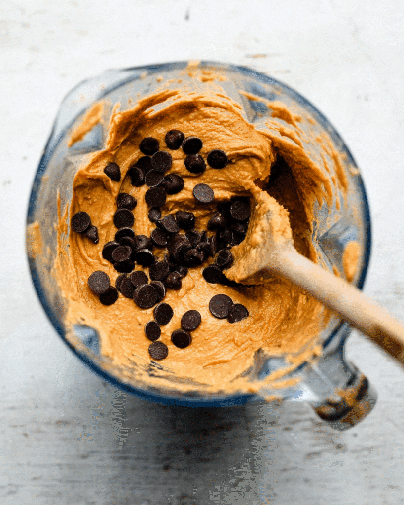 Pumpkin Chocolate Chip Protein Muffins 2 Pumpkin protein muffin batter with chocolate chips in blender