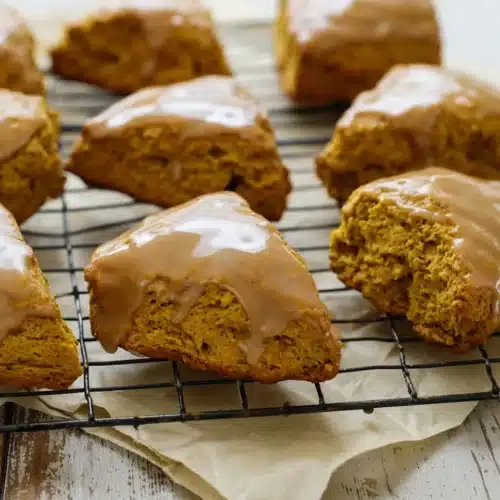 Pumpkin Scones Recipe – Perfect Fall Treat 14 Pumpkin scones with spiced glaze cooling on a wire rack