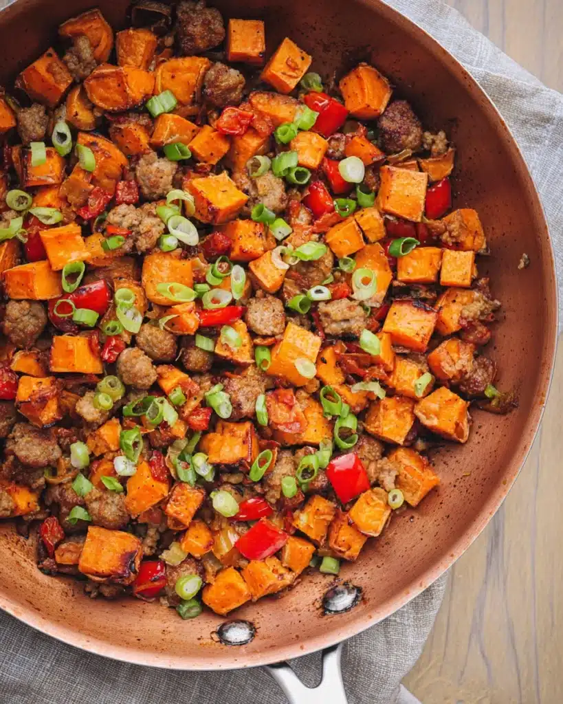 Sweet Potato Breakfast Hash (Thanksgiving Recipe) 4 Sweet potato breakfast hash in skillet with sausage and green onions