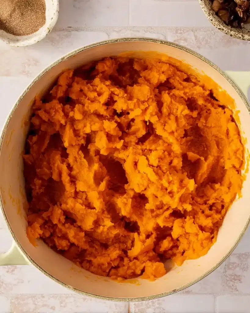 Sweet Potato Casserole with Marshmallows 3 Freshly mashed sweet potatoes in a pot for casserole