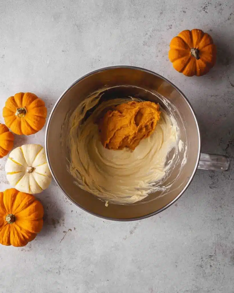 The Best Pumpkin Cheesecake Bars Ever 6 Pumpkin puree added to cheesecake batter in mixing bowl