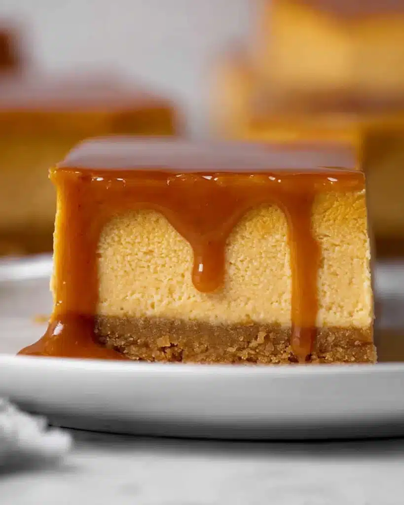 The Best Pumpkin Cheesecake Bars Ever 9 The Best Pumpkin Cheesecake Bars Ever stacked with caramel drizzle
