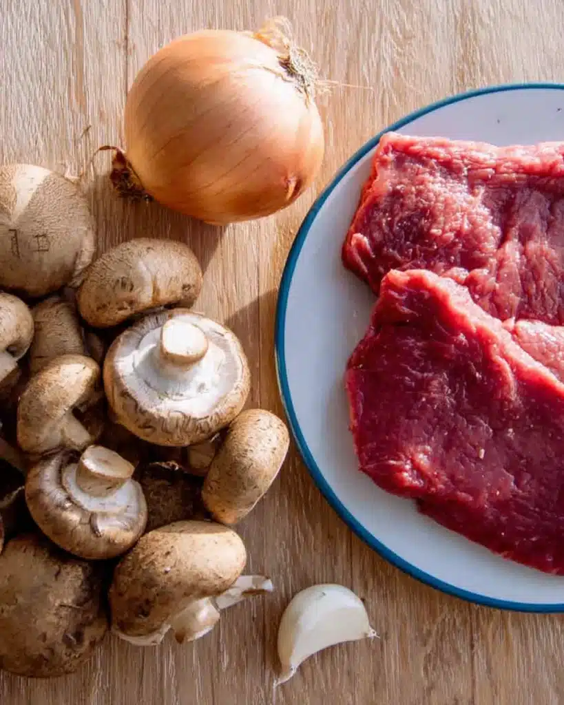 Beef Stroganoff Recipe 2 Fresh beef, mushrooms, onion, and garlic for beef stroganoff recipe