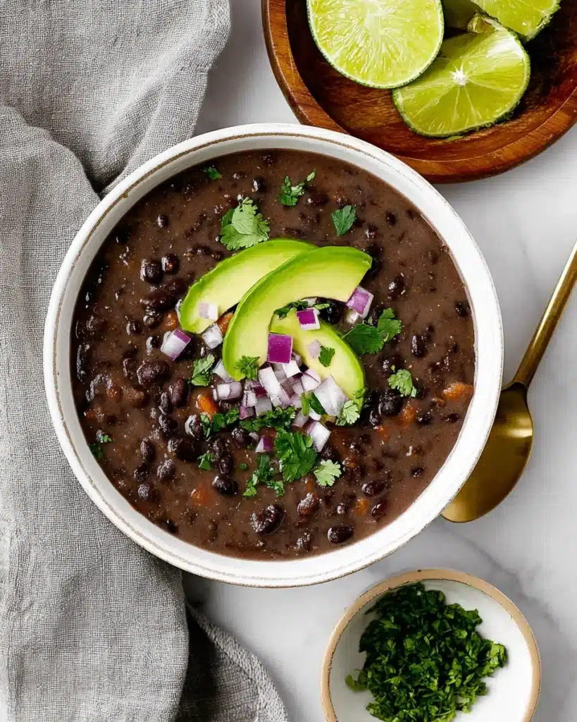Black Bean Soup 5 Creamy black bean soup topped with avocado, red onion, and cilantro