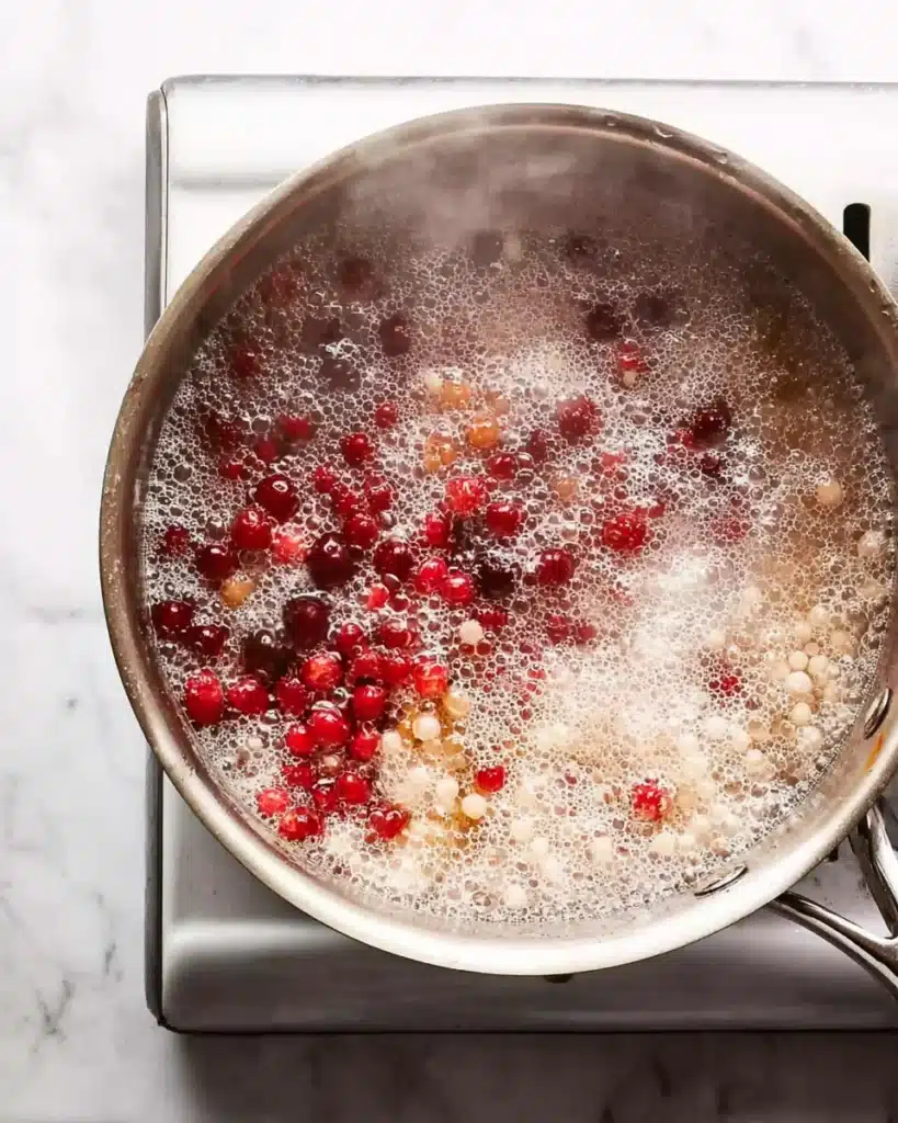 Broccoli Pearl Crunch Salad 4 Boiling pearl couscous and cranberries in a stainless steel pot