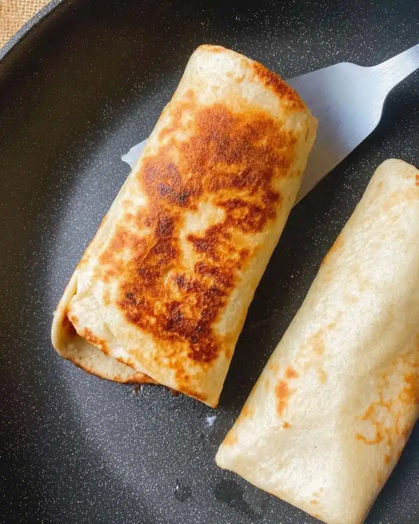 Easy Chicken Wraps (Quick & Flavorful Lunch Recipe) 5 Toasting chicken wraps in pan until golden brown