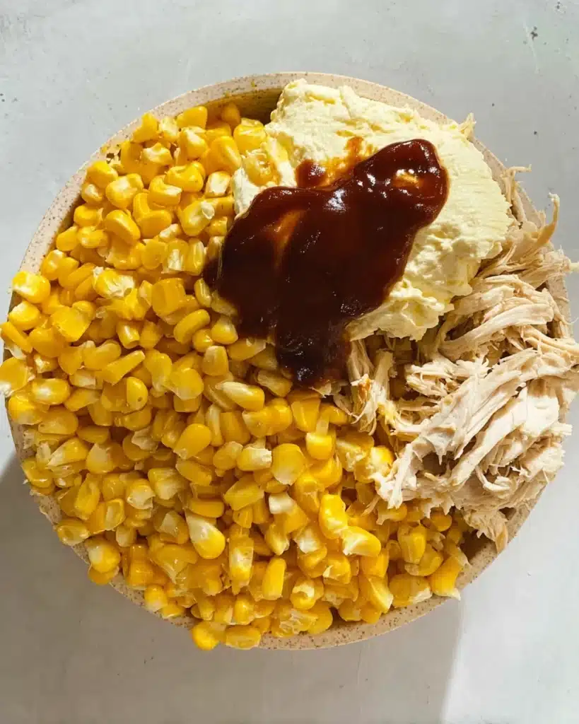 Easy Chicken Wraps (Quick & Flavorful Lunch Recipe) 3 Chicken wrap filling with sweetcorn, cream cheese, and barbecue sauce in bowl