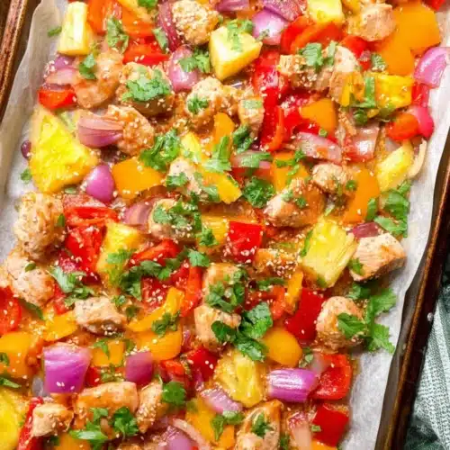 Hawaiian Chicken Sheet Pan Recipe (Easy, Healthy, and Flavorful) 5 Colorful Hawaiian chicken sheet pan with pineapple, bell peppers, and onions