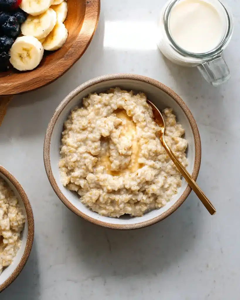 Instant Pot Steel Cut Oats 5 Creamy Instant Pot steel cut oats in a bowl with a spoon
