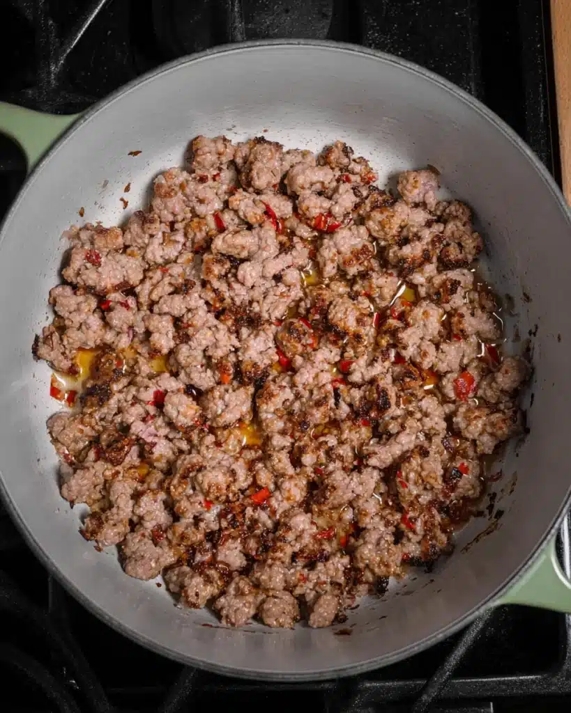 Italian Sausage and White Bean Soup (with Tuscan Kale) 2 Browning Italian sausage in a pot for Italian sausage and white bean soup