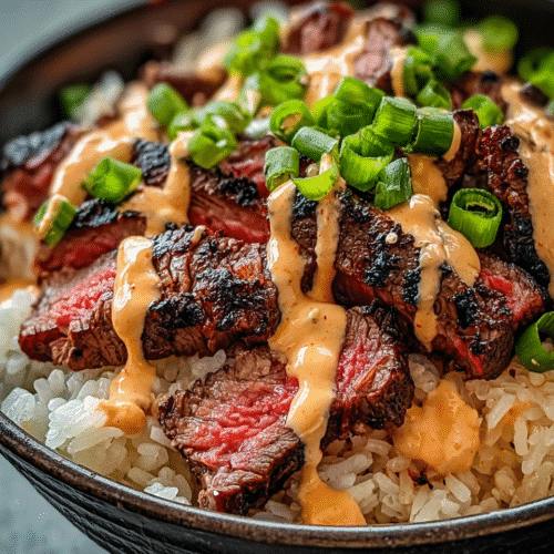 Korean BBQ Steak Rice Bowls with spicy creamy sauce and green onions