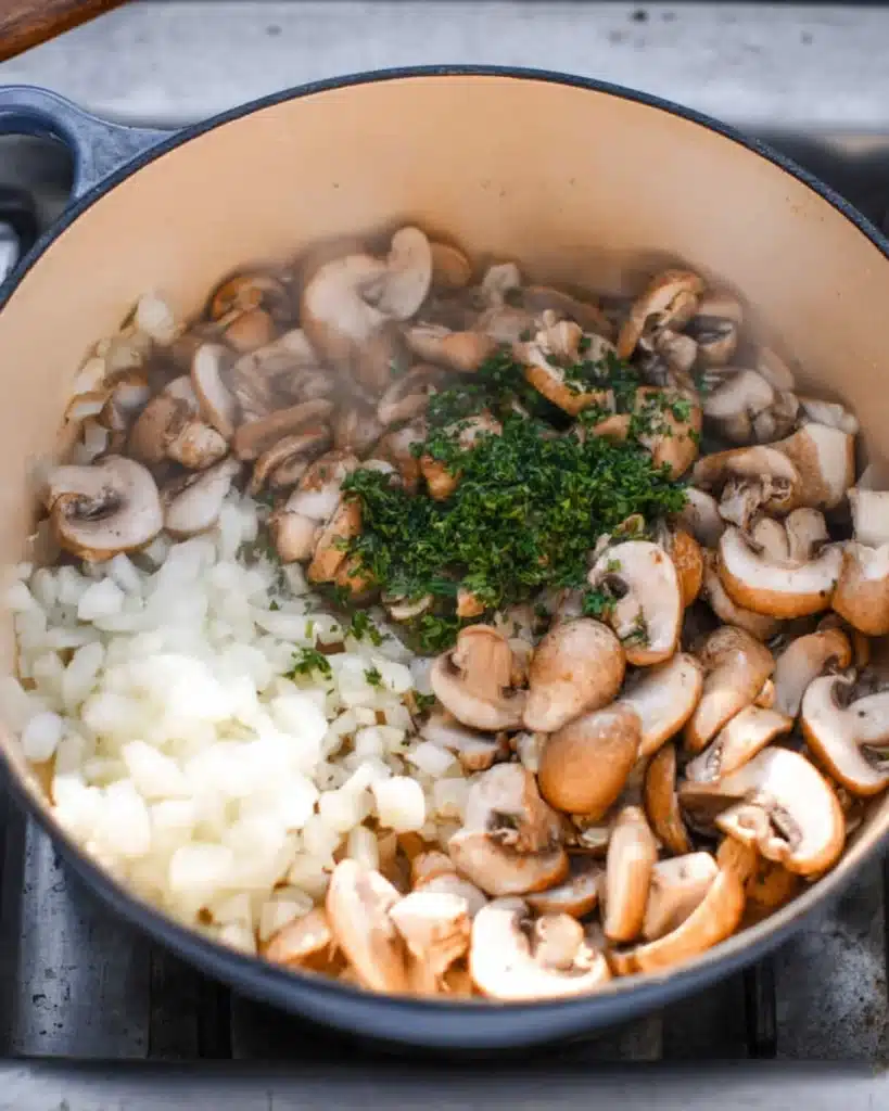 Mushroom Bisque 2 Sautéing mushrooms, onions, and herbs for creamy mushroom bisque