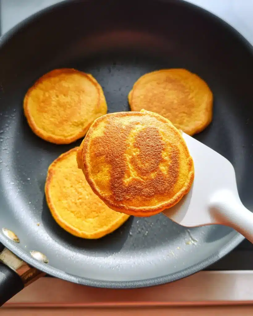 Pumpkin Cottage Cheese Pancakes 2 Pumpkin cottage cheese pancakes cooking in skillet