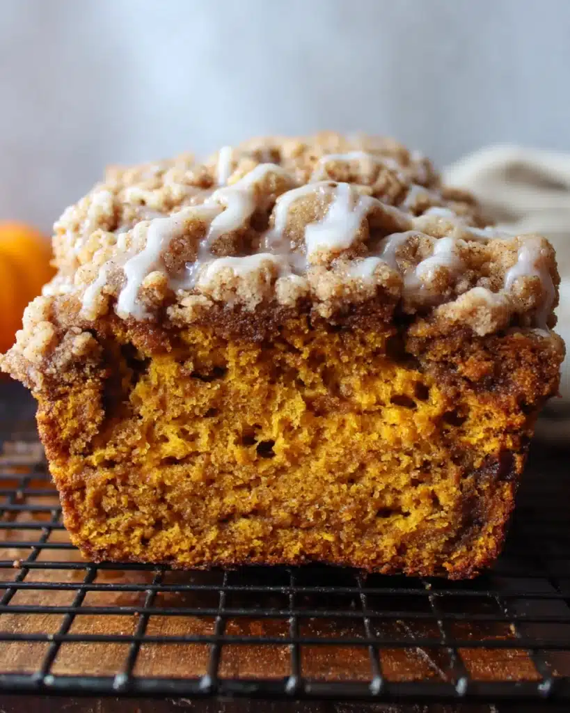 Pumpkin Streusel Bread 4 Pumpkin streusel bread loaf with crumble topping and maple glaze