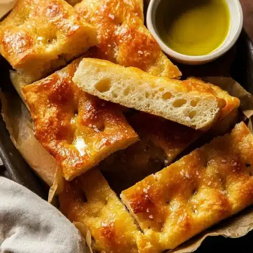 Quick and Dirty Focaccia 9 Quick and Dirty Focaccia slices with olive oil dip in rustic parchment tray