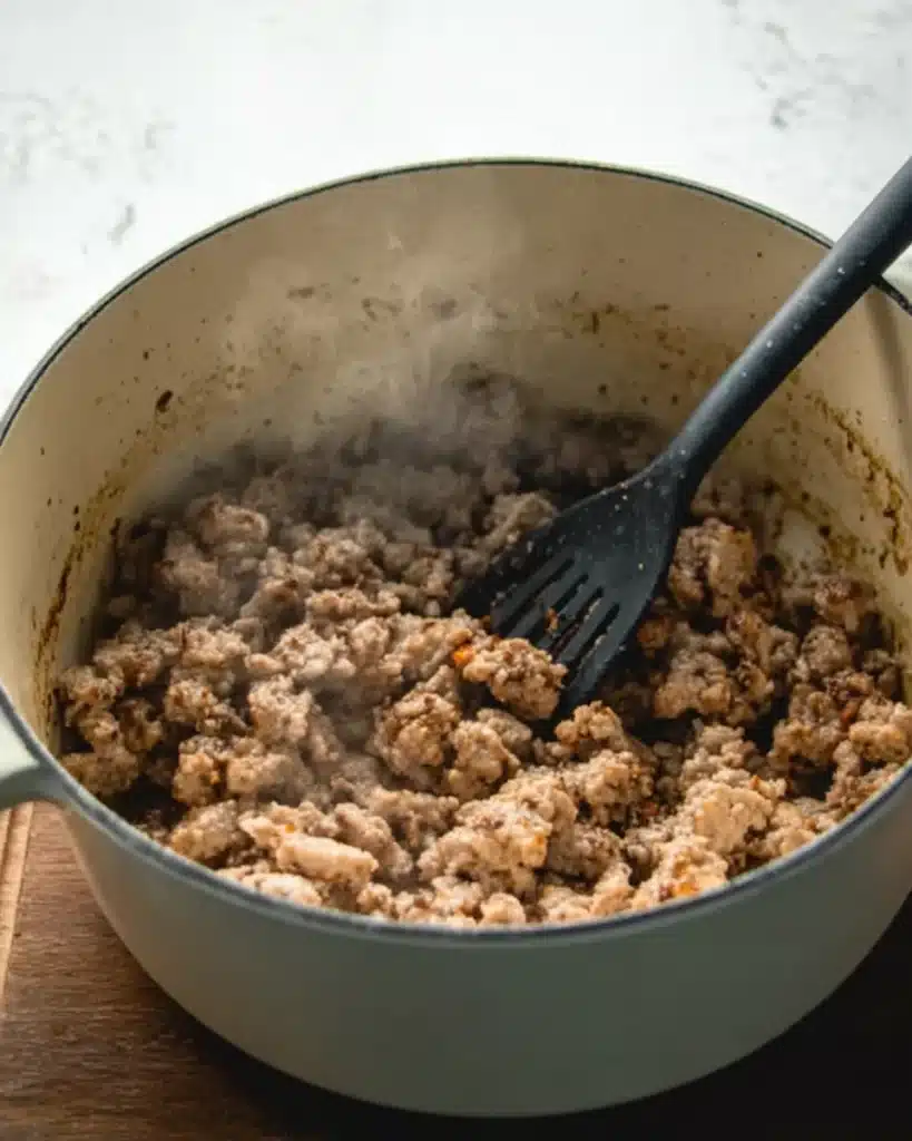 Sausage Potato Soup 2 Browning ground Italian sausage in a Dutch oven for sausage potato soup