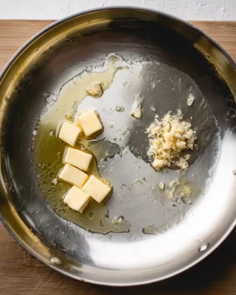Tuscan Mac and Cheese (Thanksgiving Recipe) 2 Butter, garlic, and oil in skillet for Tuscan mac and cheese sauce