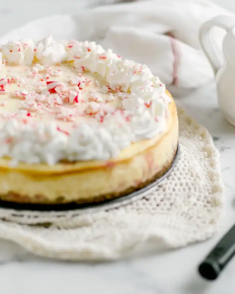 White Chocolate Peppermint Cheesecake 4 White chocolate peppermint cheesecake topped with whipped cream and peppermint candy