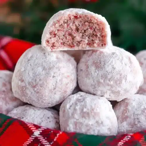 Cherry Snowball Cookies 3 Cherry Snowball Cookies with powdered sugar in a festive basket