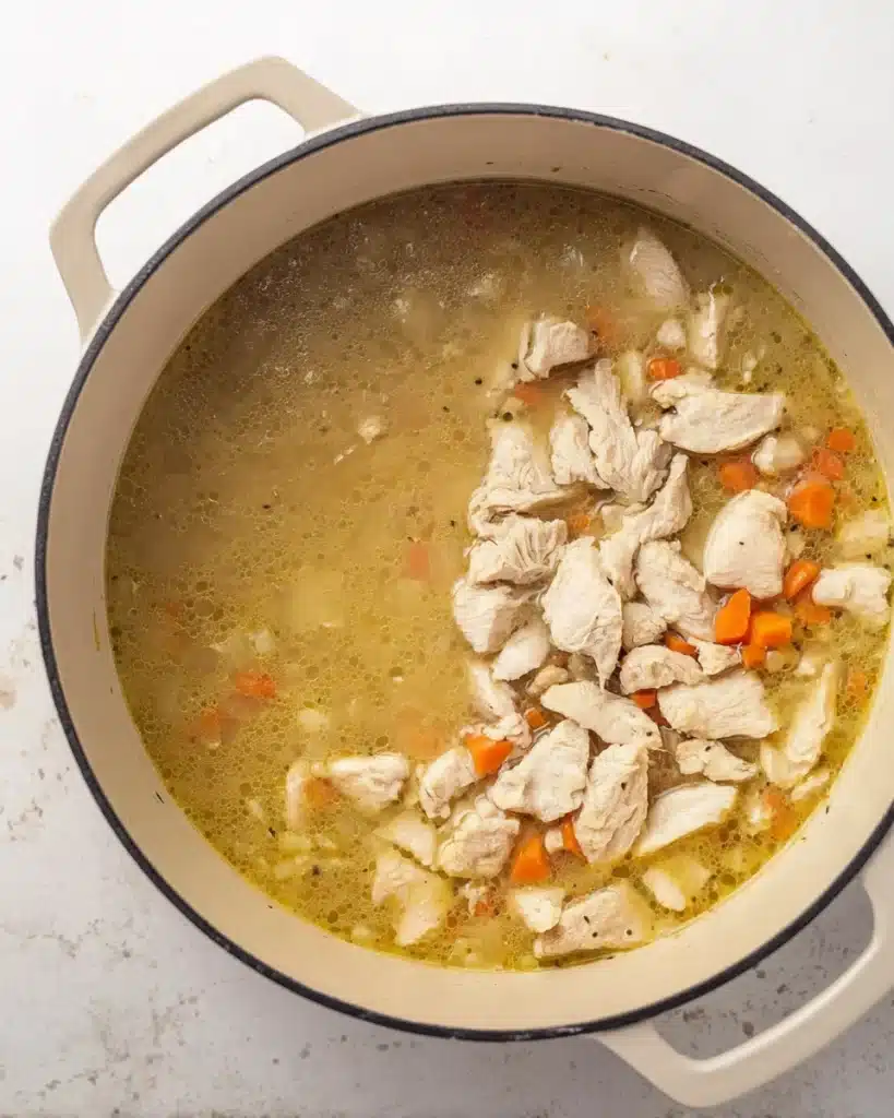 Chicken Bacon Rice Soup (Creamy, Hearty & Easy Recipe) 7 Chicken pieces simmering in golden broth for chicken bacon rice soup