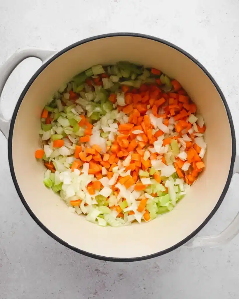 Chicken Bacon Rice Soup (Creamy, Hearty & Easy Recipe) 4 Chopped onions, carrots, and celery in a Dutch oven for chicken bacon rice soup