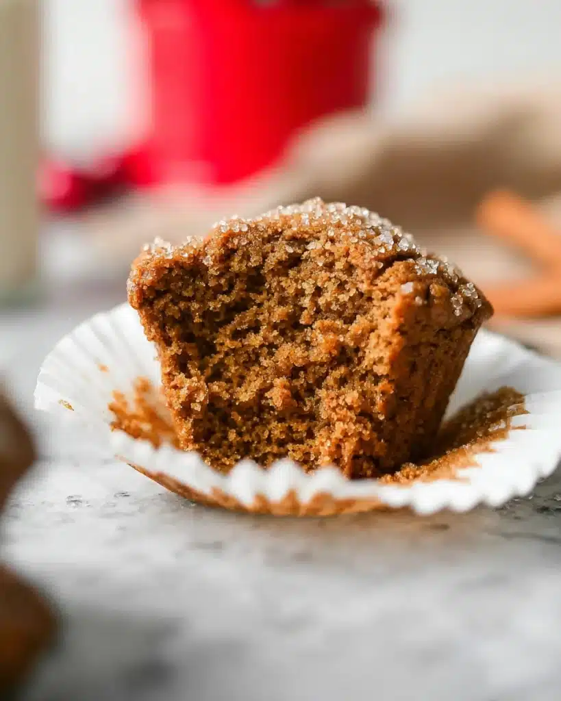 Gingerbread Muffins 4 Half-eaten gingerbread muffin showing moist, spiced crumb