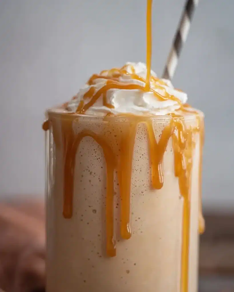 McDonald’s Caramel Frappe (Easy Copycat Recipe) 1 Creamy caramel frappe with whipped cream and caramel drizzle in a tall glass