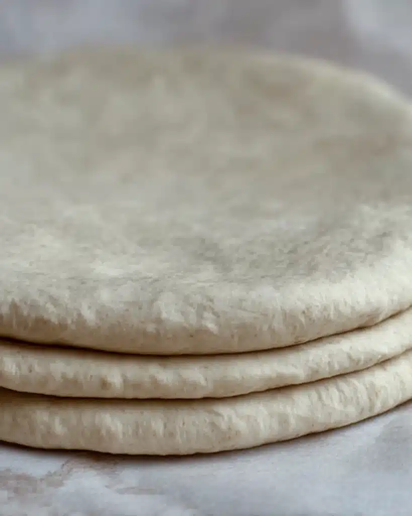 Sourdough Discard Star Bread – A Festive Christmas Showstopper 5 Stacked sourdough discard star bread dough layers on parchment paper