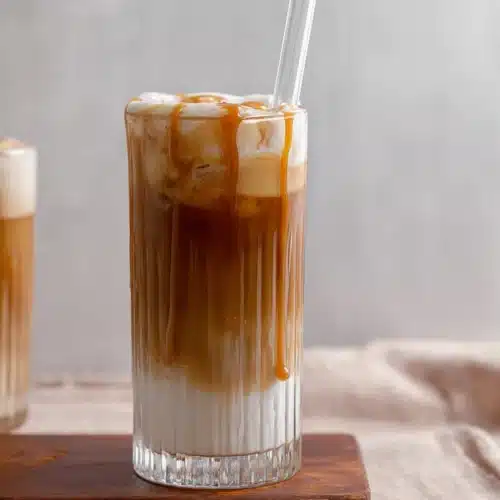 Starbucks salted caramel cold foam cold brew and caramel drizzle in a ribbed glass