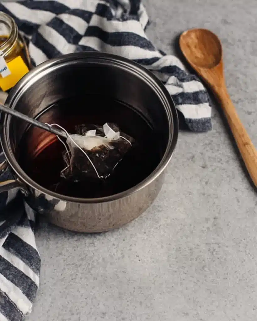 Sweet Tea Recipe – The Perfect Refreshing Southern Drink 2 Steeping black tea bags in saucepan for sweet tea
