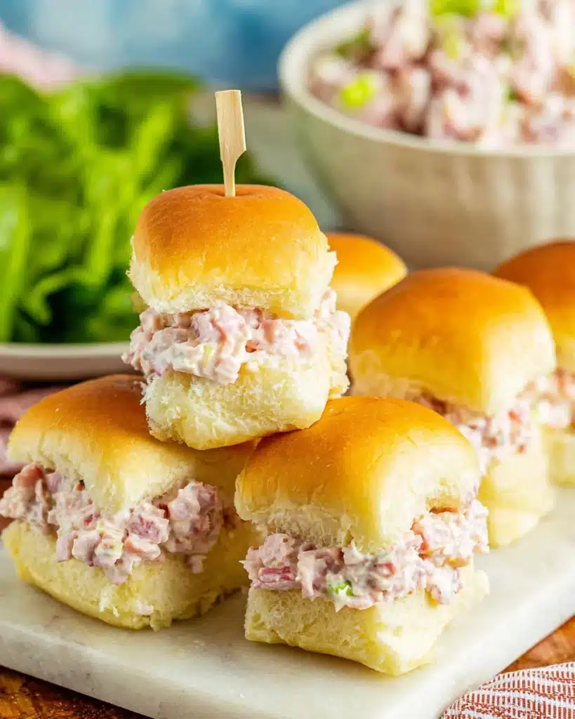 Ham salad sliders with creamy filling on golden rolls
