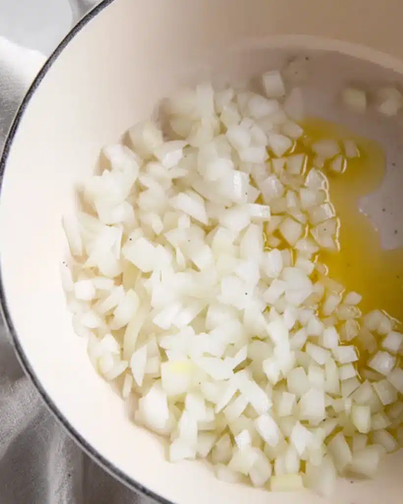 Zucchini Soup 2 Chopped onions in pot with olive oil for zucchini soup