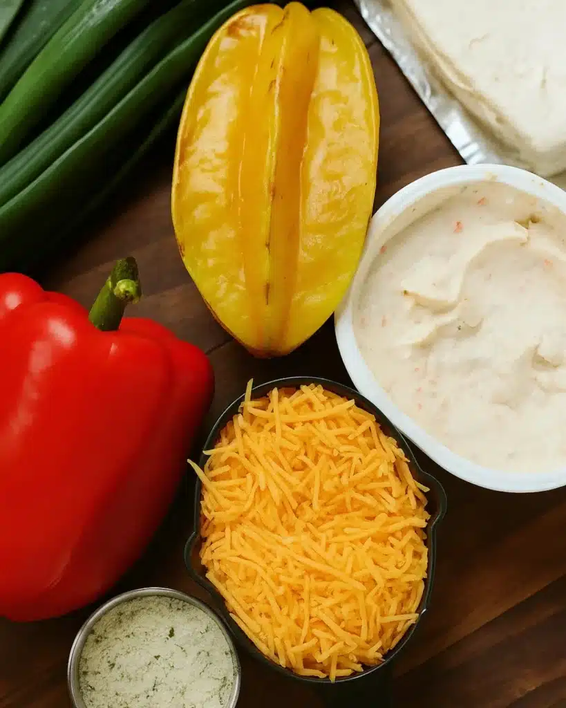 Christmas Tree Cheeseball 2 Christmas Tree Cheeseball ingredients including cream cheese, cheddar, and red pepper