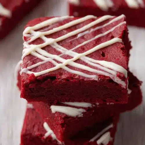 Fudgy Red Velvet Brownies 6 Fudgy red velvet brownies with white chocolate drizzle on top