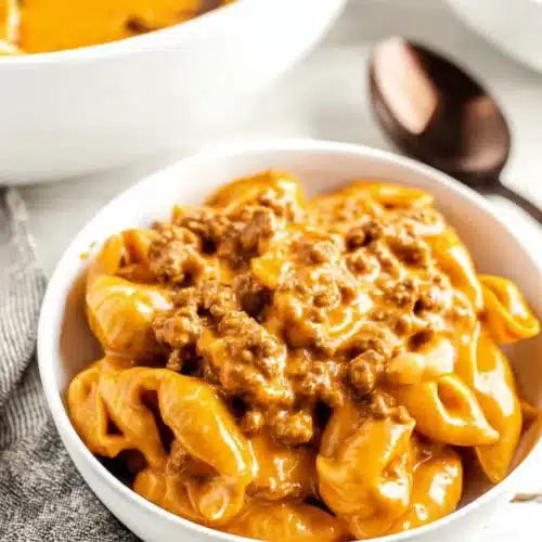 Homemade Hamburger Helper 6 Creamy homemade hamburger helper with cheesy pasta shells and ground beef in a white bowl