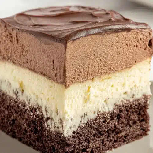Slice of Italian Love Cake with chocolate layers and creamy ricotta
