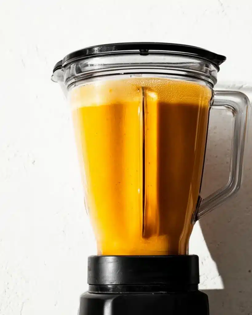 Roasted Butternut Squash Soup 3 Blender filled with creamy roasted butternut squash soup