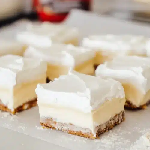 No-bake banana cream pie bars with vanilla wafer crust and whipped topping