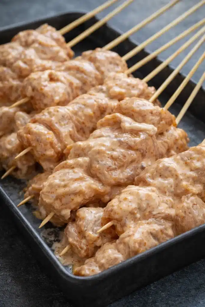 Bang Bang Chicken Skewers 2 Raw Bang Bang Chicken Skewers coated in creamy chili sauce