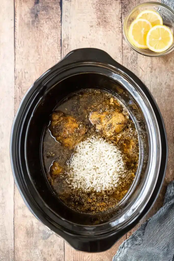 CrockPot Lemon Chicken and Rice 2 CrockPot Lemon Chicken and Rice with uncooked rice added to slow cooker